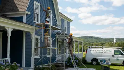 Painting contractors in Burlington, VT preparing a home exterior for professional painting